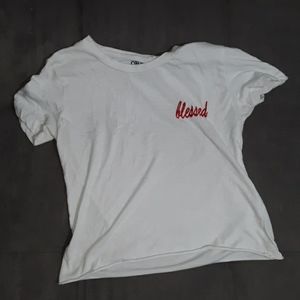 A white crop top with the word "blessed"